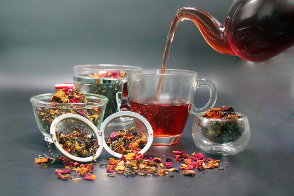 Close-up of a tea set with Darjeeling tea, featuring herbal infusions and vibrant tea leaves.